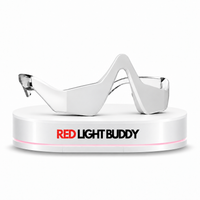 Eye Snatcher Buddy red light and EMS eye device on a white podium